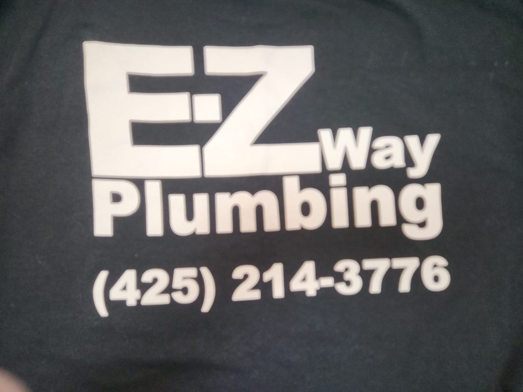 Black shirt with white text: "EZ Way Plumbing (425) 214-3776.