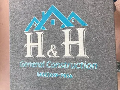 Gray shirt with "H & H General Construction" logo, blue roof graphic, and phone number (425) 359-7956.